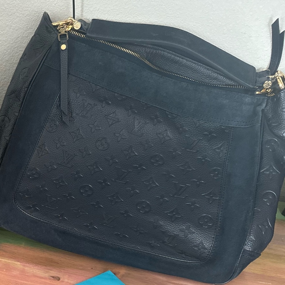 Louis Vuitton purse, travel bag